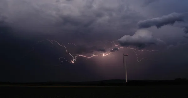 Beautiful lightning and wind turbine panorama