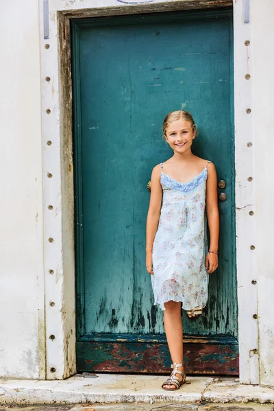 Happy beautiful young girl in summer dress
