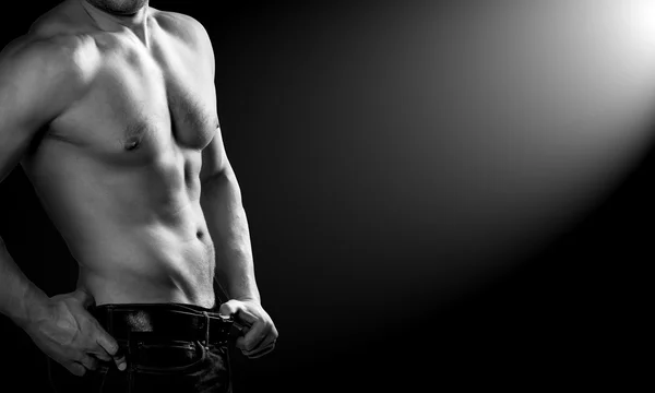 Male body on black background with copy space