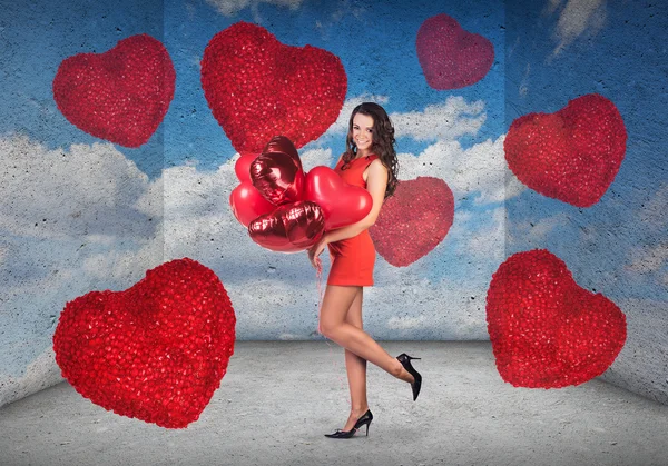 Woman with a heart-shaped balloons