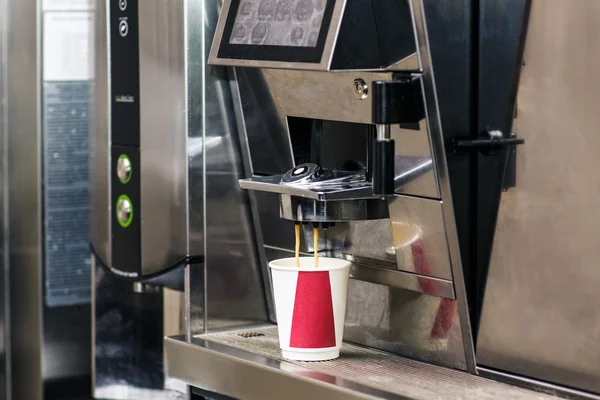 Coffee machine making a cup of coffee.