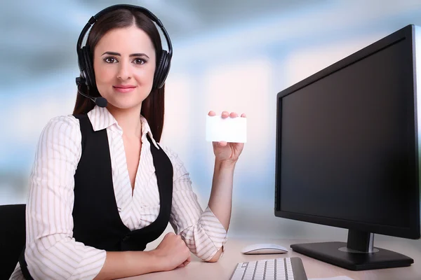 Woman holding a card to include contact detail