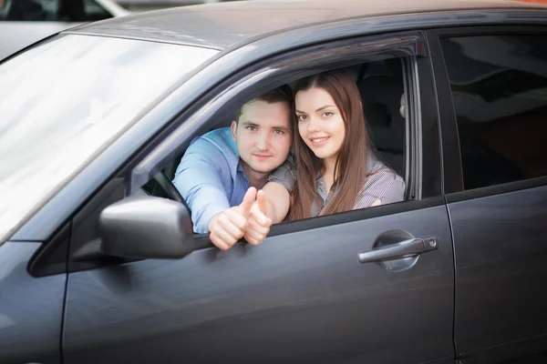 Happy couple in the car