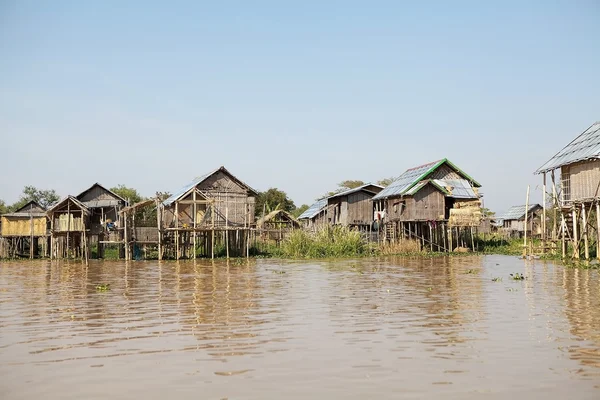 Village with traditional wooden stilt houses on the Lake Inle Myanmar