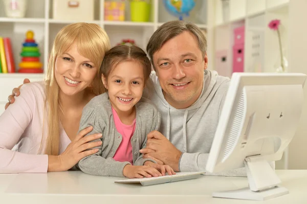 Happy family   with computer