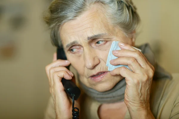 Senior woman calling doctor
