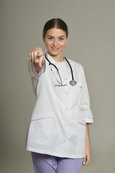 Female doctor pointing at you