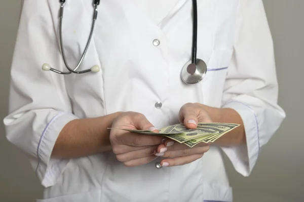 Female doctor with money