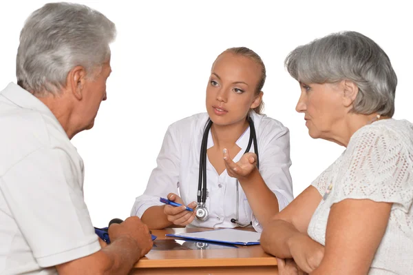 Couple and young doctor at hospital