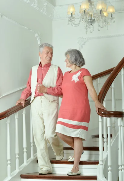 Beautiful elderly couple on stairs