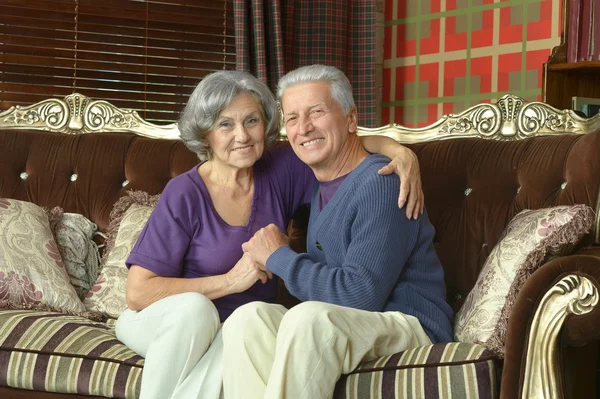 Beautiful elderly couple on sofa