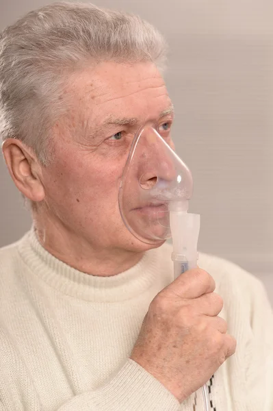 Elderly man with flu inhalation