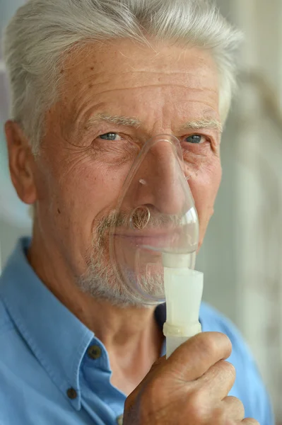 Elderly man with flu inhalation