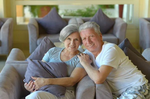 Beautiful elderly couple on sofa