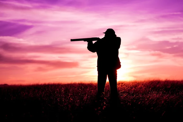 Hunter With Shotgun at Sunset