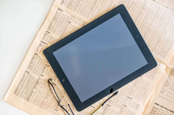 Modern iPad Tablet computer and Financial Times magazine
