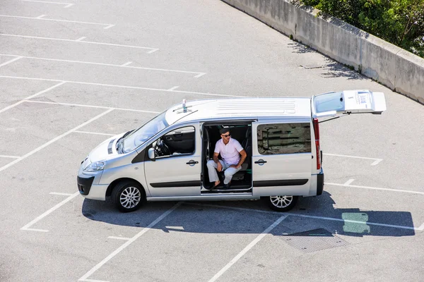 Man in empty parking lot taxi driver