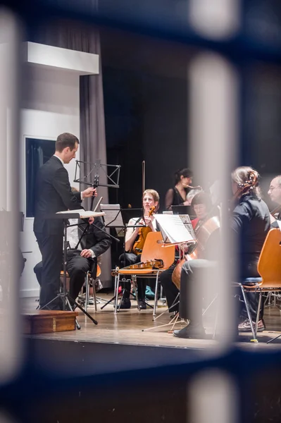 View through the window at orchestra