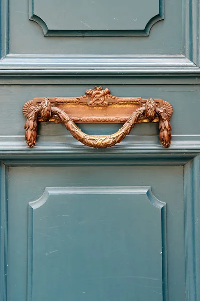 Luxury vintage door handle on a turquoise painted door i