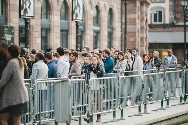 Woman leaving Apple Store waiting line