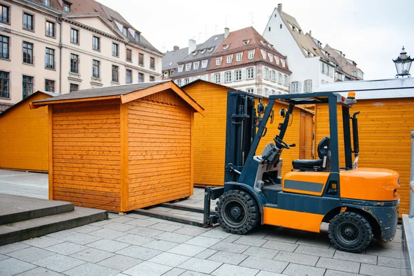 Forklift arranging market stall