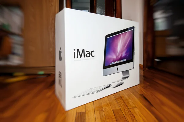 Apple iMac computer in box in front of door