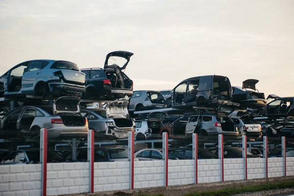 Stacked crushed cars for parts