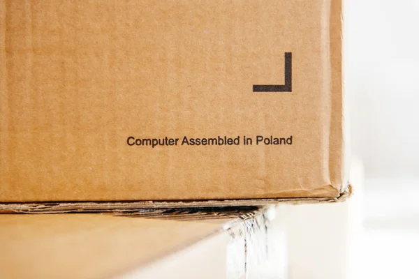 Computer assembled in Poland inscription on a cardboard box
