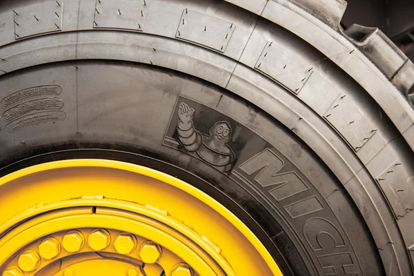 Michelin tire on yellow tractor