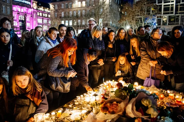 People gathering in solidarity with victims from Paris assaults