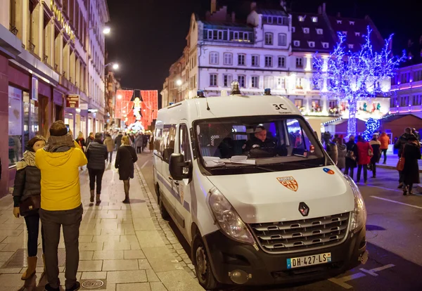 Police car patrol the streets during Christmas Market