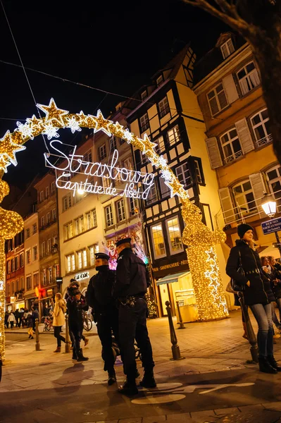 Two police officer surveilling Christmas Market in France