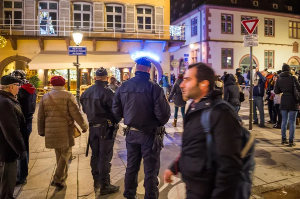 Police officers surveilling Christmas Market