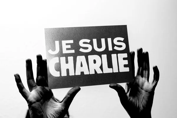 Je Suis Charlie in French language in black hands