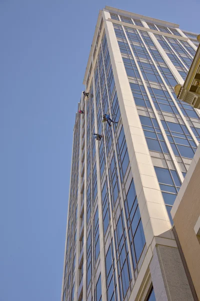 Window washers on a high rise building.