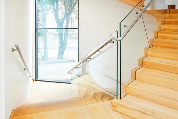 Modern interior with wooden stairs