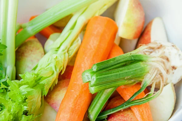 Fresh organic raw celery carrot and apple