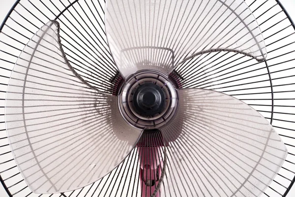 Dirty electric fan on white background