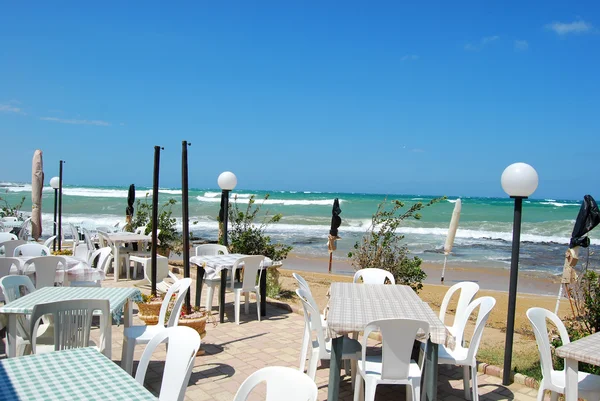 A romantic restaurant on the beach swept by the Mistral in Apuli