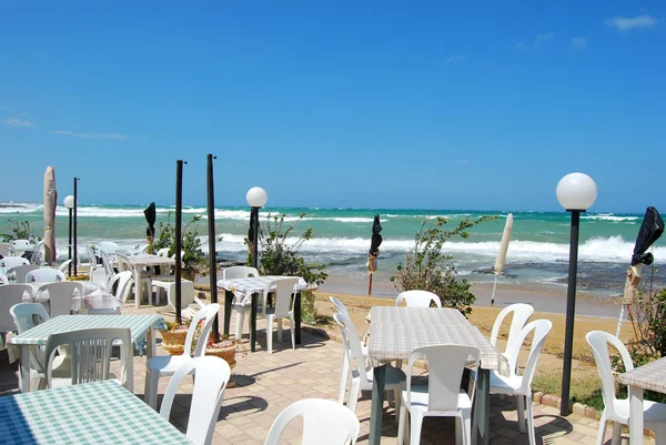 A romantic restaurant on the beach swept by the Mistral in Apuli