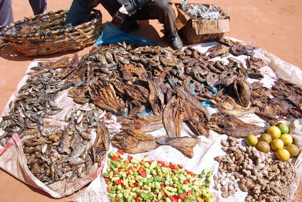 Dried fish, chillies and lemons for sale at the market in Pomeri