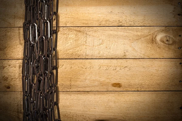 Brown Chain on a Wooden Background