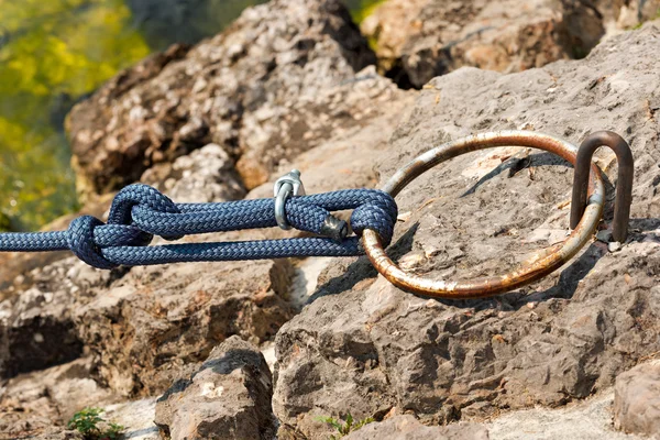 Mooring Ring with a Blue Rope