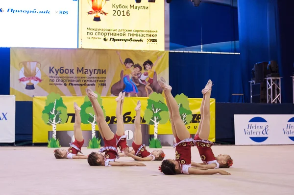 Children compete in international competitions on sport gymnastics \