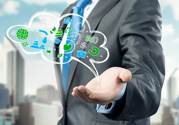 Businessman showing cloud with business sketches