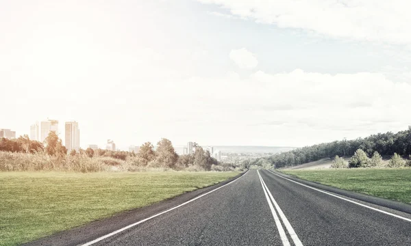 Asphalt road to horizon