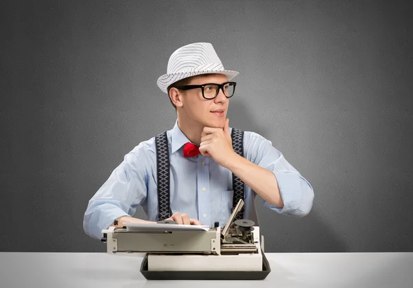 Man writer with typing machine