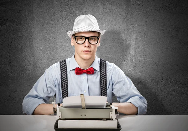 Man writer with typing machine