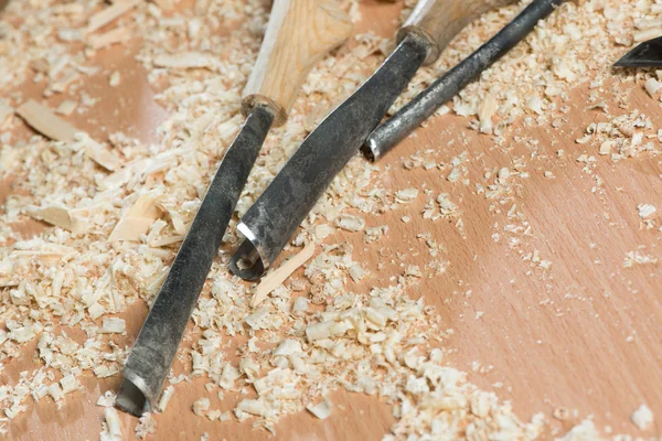 Carpenter's tools lying among sawdust