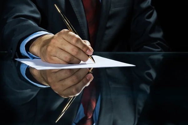 Businessman signing document